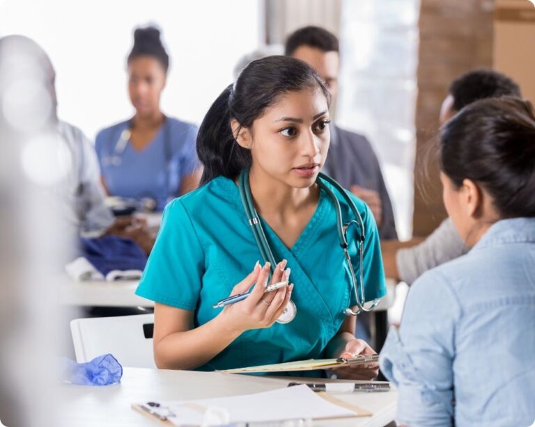 An emotionally intelligent nurse interacting with a co-worker.