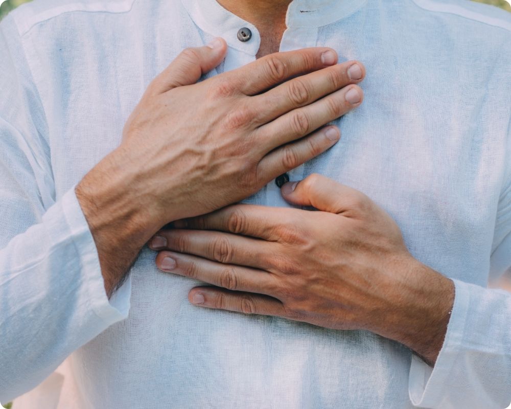 Nurse engaging in breath work. Breath work is a self-care activity for nurses.