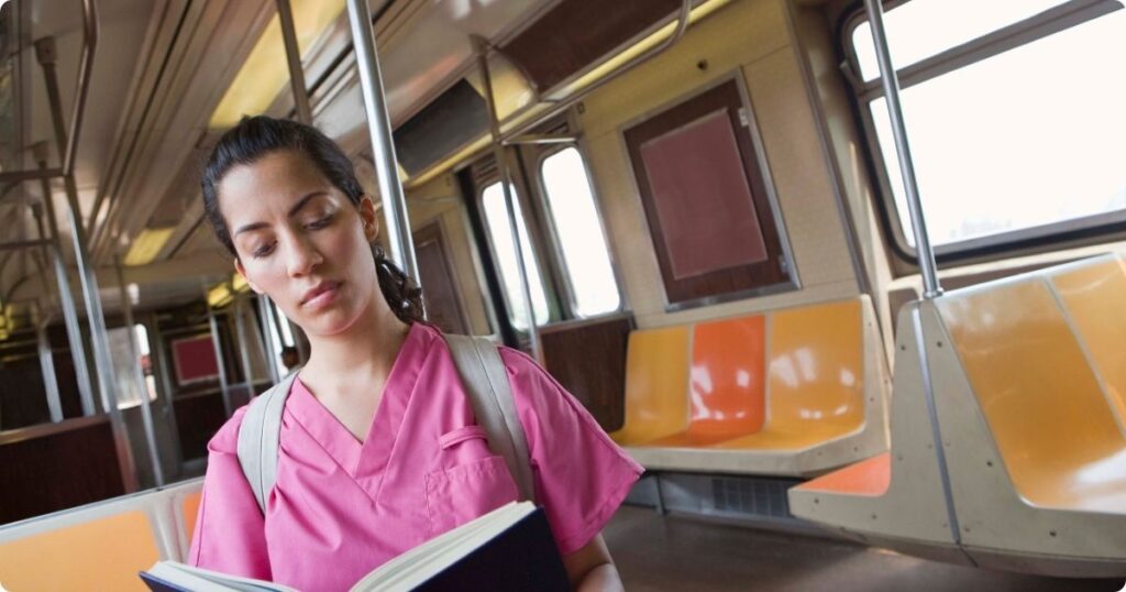 Nurse taking a few free moments to read Top Professional Books for Nurses.