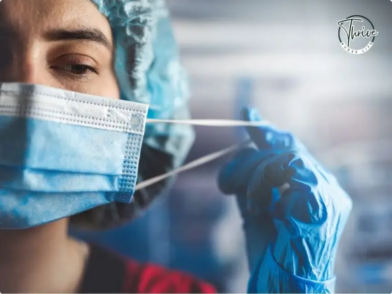 A nurse taking off her mask with a blank expression representing emotional exhaustion.